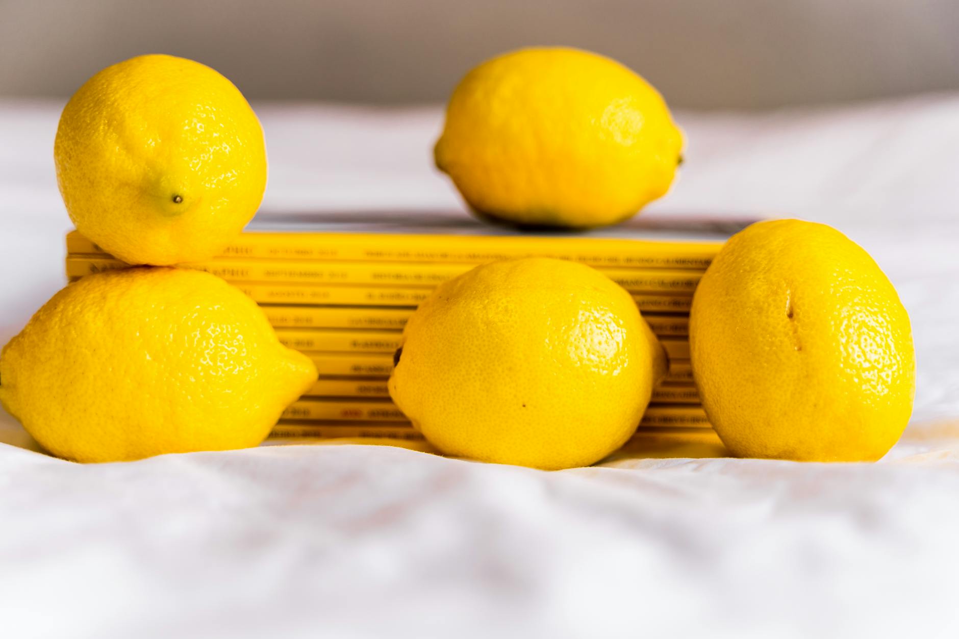 Colorful array of lemon vibrators and adult toys arranged on a bright yellow background
